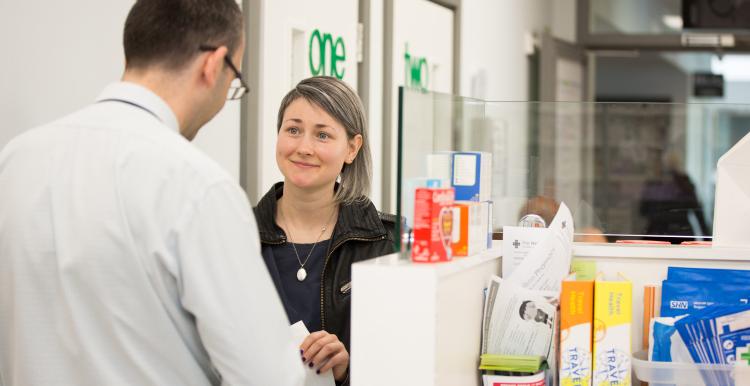 lady speaking to pharmacist