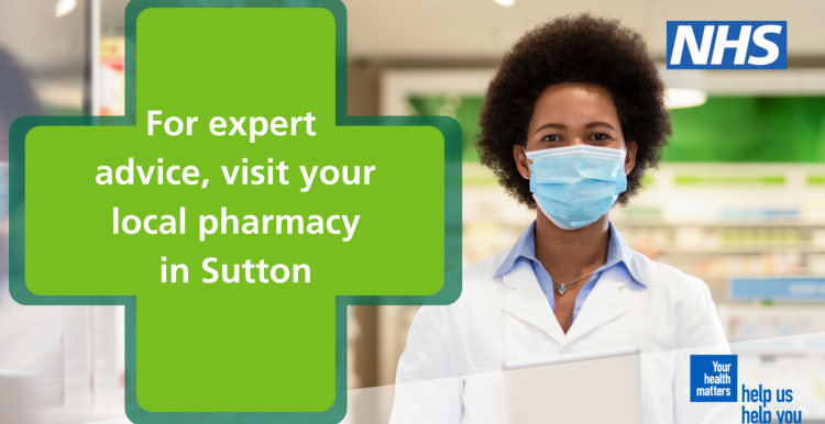 pharmacist wearing a mask standing behind a counter