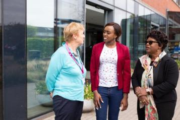 Three women outside a hospital